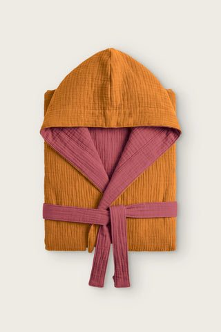 Reversible 4-layer muslin hooded bathrobe, caramel outer and burgundy inner, folded front view
