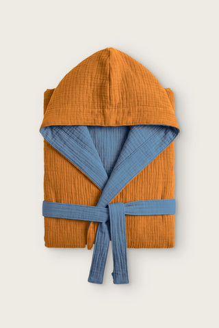 Reversible 4-layer muslin hooded bathrobe, caramel outer and indigo blue inner, folded front view