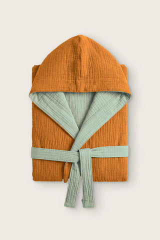 Reversible 4-layer muslin hooded bathrobe, caramel outer and sage green inner, folded front view