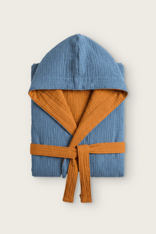Reversible 4-layer muslin hooded bathrobe, indigo blue outer and caramel inner, folded front view