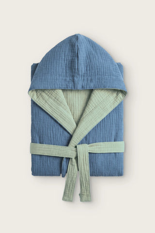 Reversible 4-layer muslin hooded bathrobe, indigo blue outer and sage green inner, folded front view