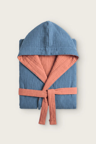 Reversible 4-layer muslin hooded bathrobe, indigo blue outer and terracotta inner, folded front view