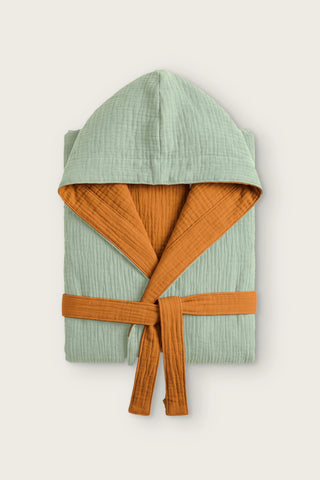 Reversible 4-layer muslin hooded bathrobe, sage green outer and caramel inner, folded front view