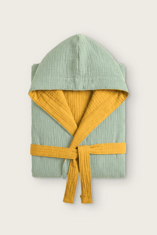 Reversible 4-layer muslin hooded bathrobe, sage green outer and mustard inner, folded front view