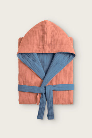 Reversible 4-layer muslin hooded bathrobe, terracotta outer and indigo blue inner, folded front view