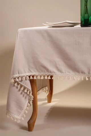Beige handwoven solid color Turkish cotton tassel tablecloth detail. Tasseled edges Denizli, OEKO-TEX. Vivamaison.