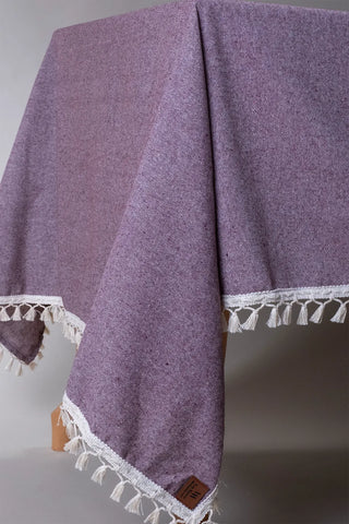 Plum handwoven solid color Turkish cotton tassel tablecloth folded flat lay. Tasseled edges Denizli, OEKO-TEX. Vivamaison.