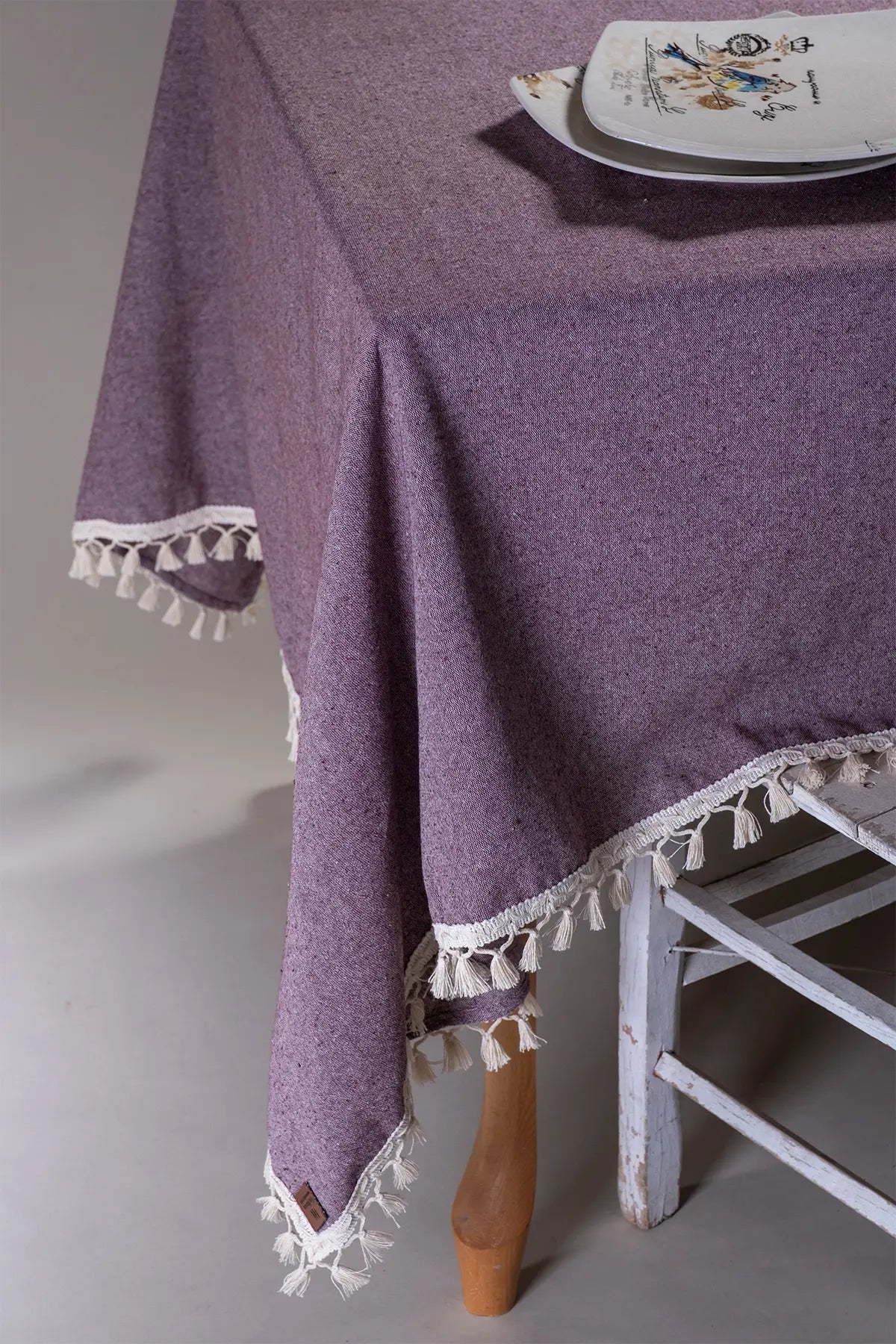 Plum handwoven solid color Turkish cotton tassel tablecloth lifestyle. Tasseled edges Denizli, OEKO-TEX. Vivamaison.