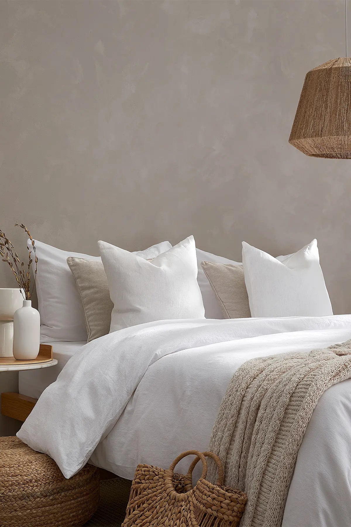 White stonewashed Turkish cotton duvet cover, on a bed in the bedroom. Made in Denizli, Turkey. VivaMaison