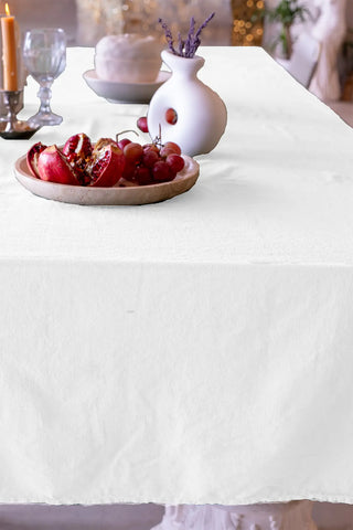 White handwoven stonewashed Turkish cotton tablecloth folded flat lay. Vintage-soft Denizli, OEKO-TEX. Vivamaison.