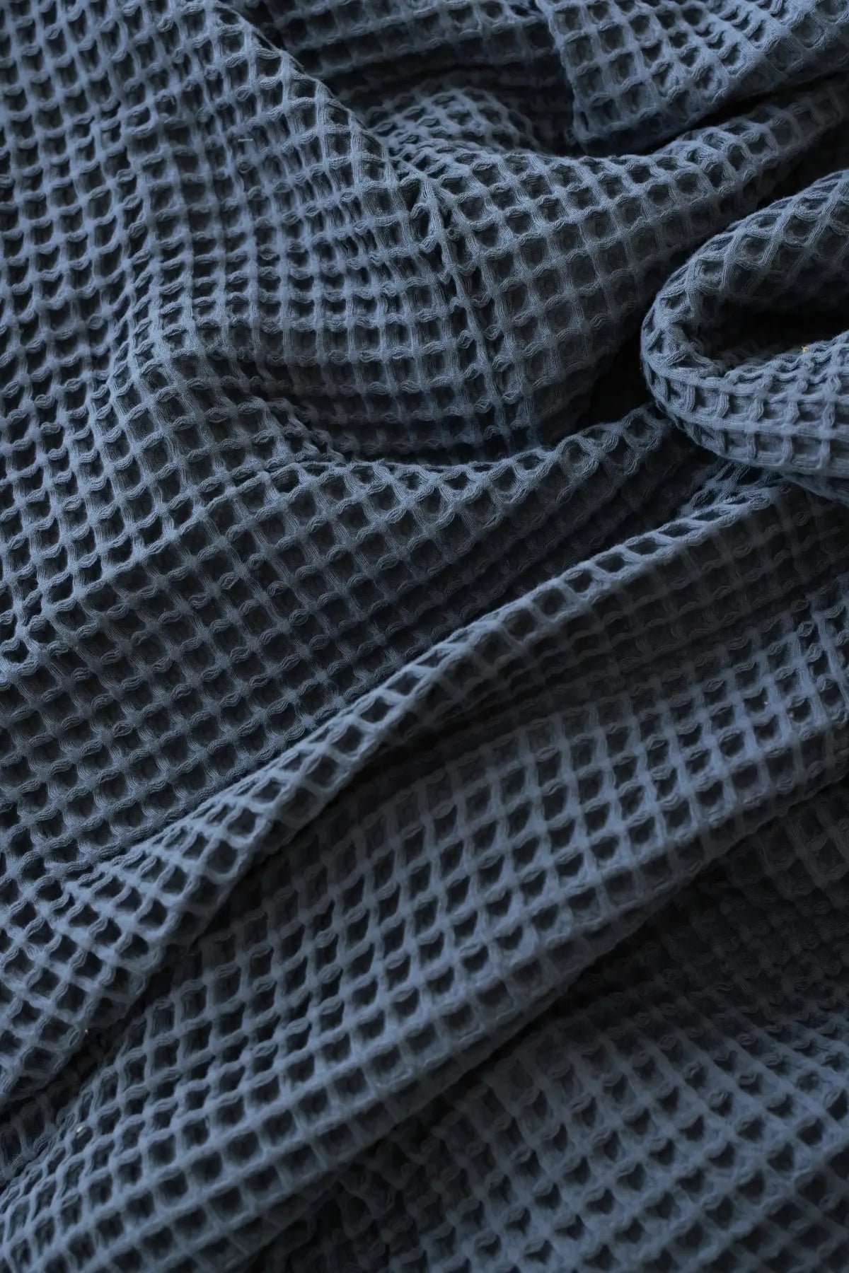 Anthracite handwoven Turkish cotton waffle weave bedspread folded flat lay. 350 GSM Denizli, OEKO-TEX. Vivamaison.