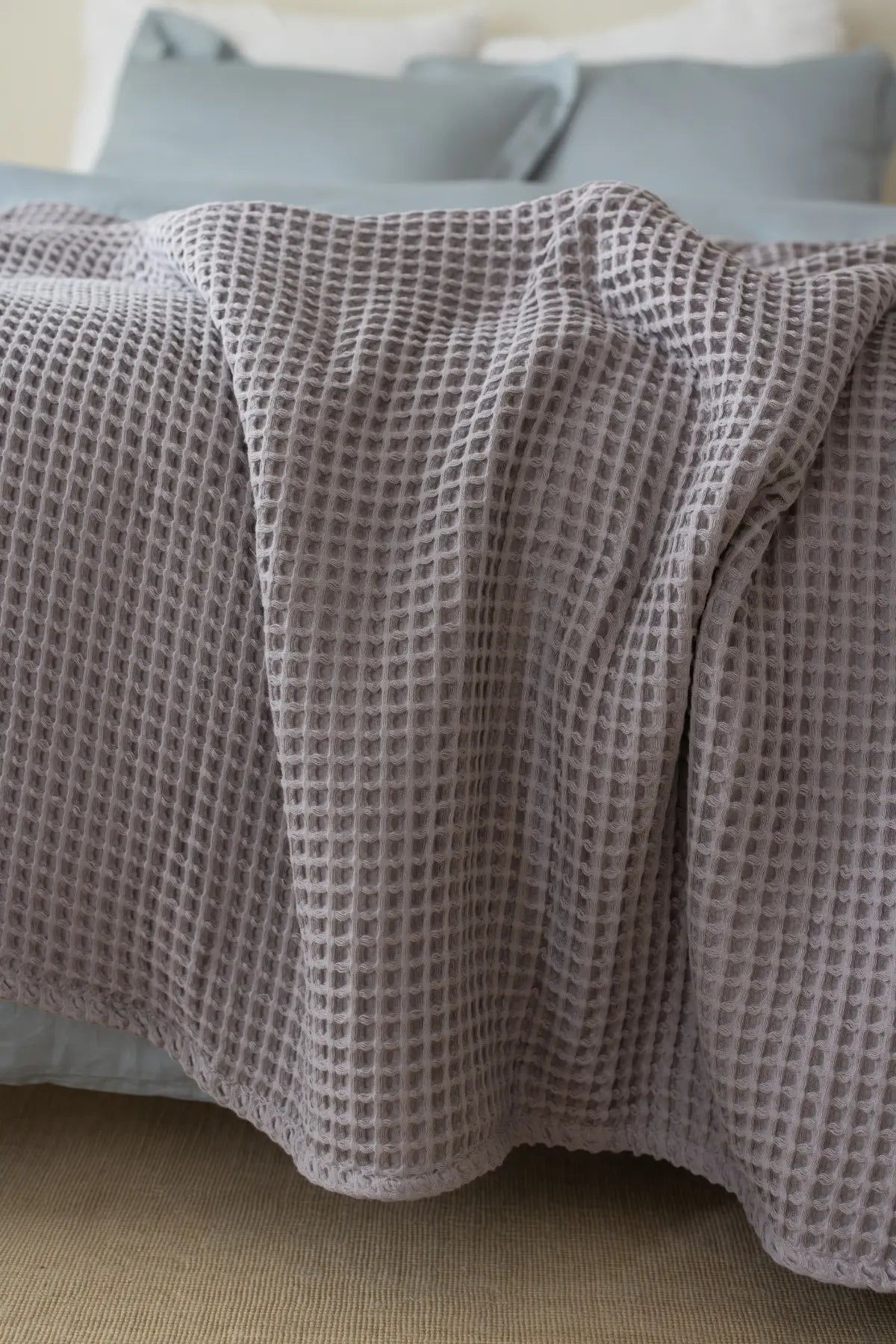 Grey handwoven Turkish cotton waffle weave bedspread folded flat lay. 350 GSM Denizli, OEKO-TEX. Vivamaison.