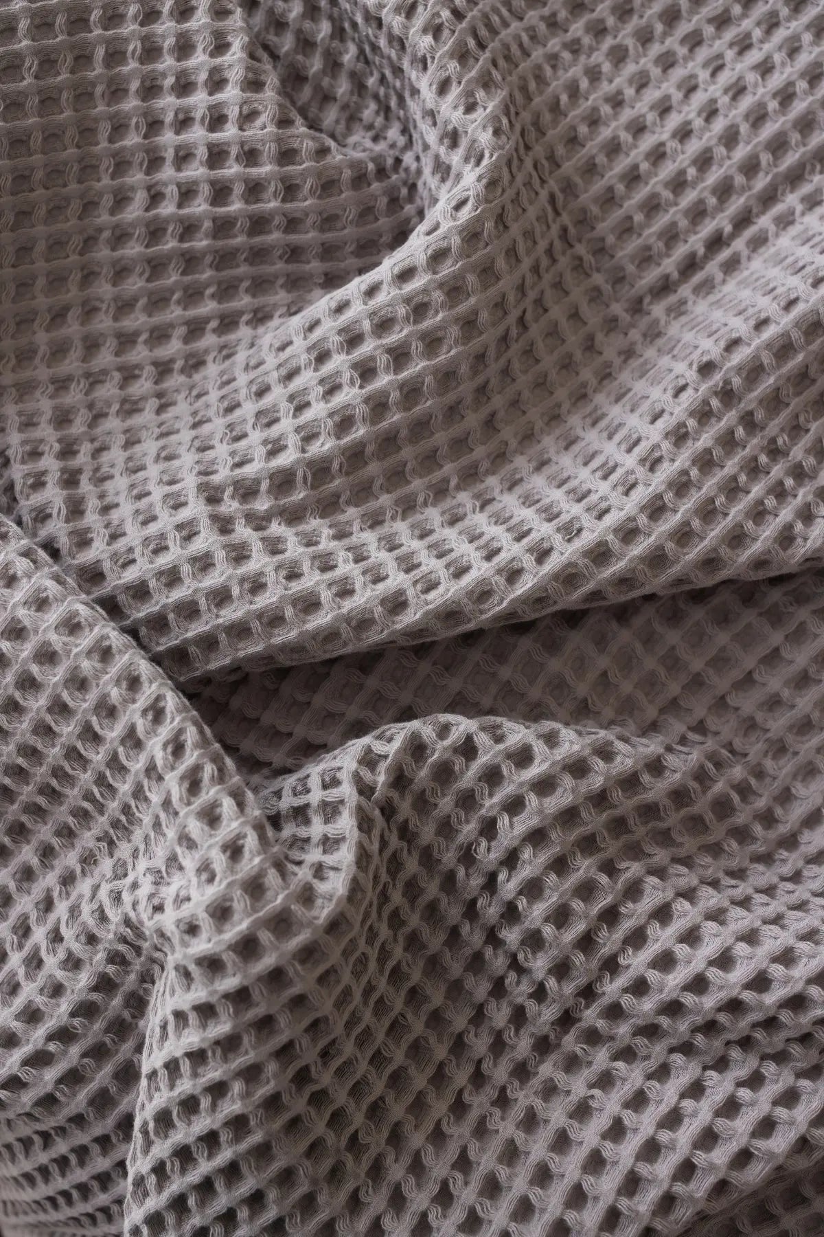 Grey handwoven Turkish cotton waffle weave bedspread lifestyle. 350 GSM Denizli, OEKO-TEX. Vivamaison.