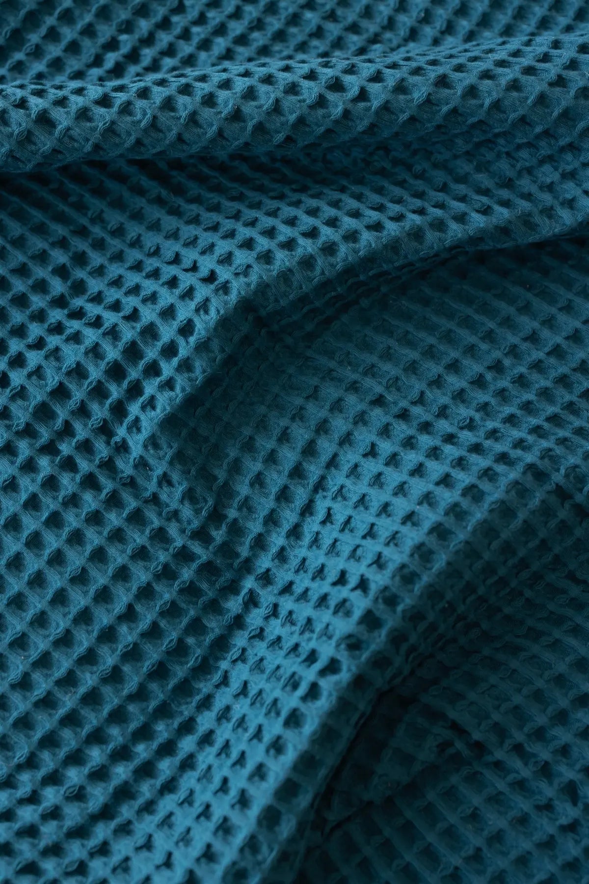 Indigo Blue handwoven Turkish cotton waffle weave bedspread folded flat lay. 350 GSM Denizli, OEKO-TEX. Vivamaison.
