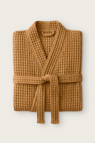 Handwoven waffle kimono bathrobe in caramel, folded front view with tied belt