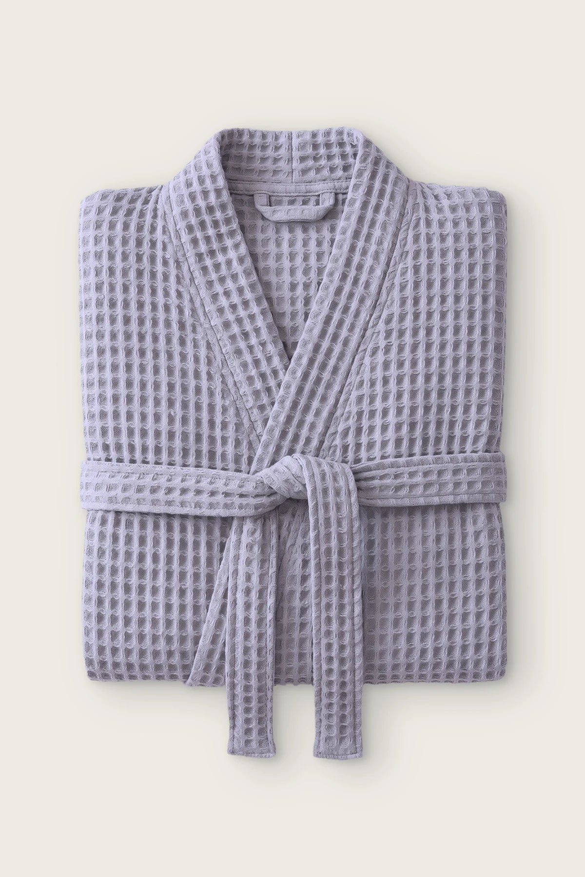 Handwoven waffle kimono bathrobe in grey, folded front view with tied belt