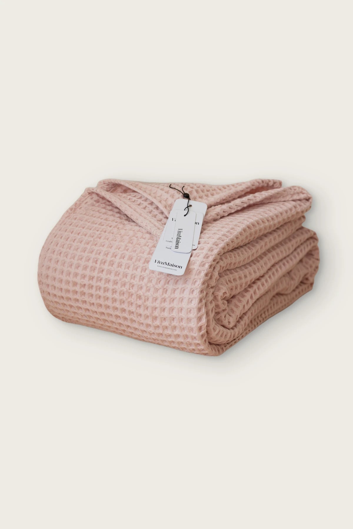 Handwoven Turkish cotton waffle weave bedspread in pink, folded front view
