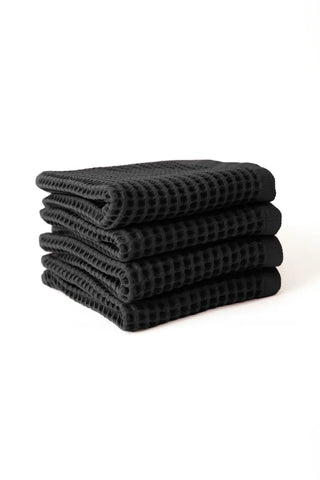 Black handwoven Turkish cotton waffle weave towel set of 4 hand towels stacked. Denizli, OEKO-TEX. Vivamaison.