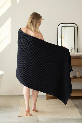 Black handwoven Turkish cotton waffle weave towel lifestyle back view. Denizli, OEKO-TEX. Vivamaison.