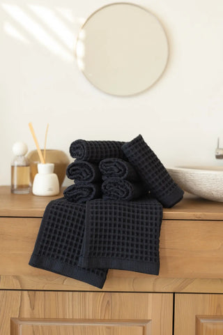 Black handwoven Turkish cotton waffle weave towel washcloth detail. Denizli, OEKO-TEX. Vivamaison.