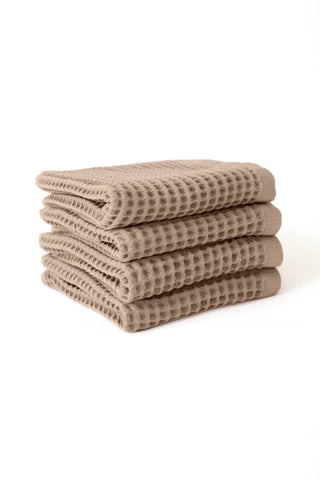 Brown handwoven Turkish cotton waffle weave towel set of 4 hand towels stacked. Denizli, OEKO-TEX. Vivamaison.