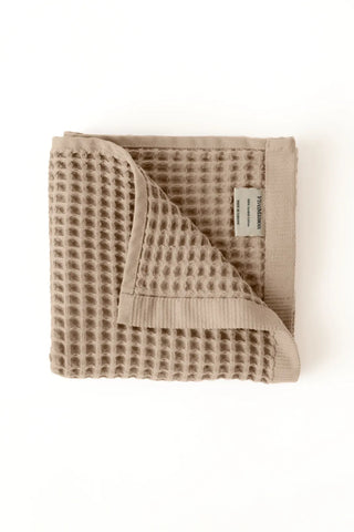 Brown handwoven Turkish cotton waffle weave towel hand towel folded detail. Denizli, OEKO-TEX. Vivamaison.