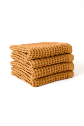 Caramel handwoven Turkish cotton waffle weave towel set of 4 hand towels stacked. Denizli, OEKO-TEX. Vivamaison.