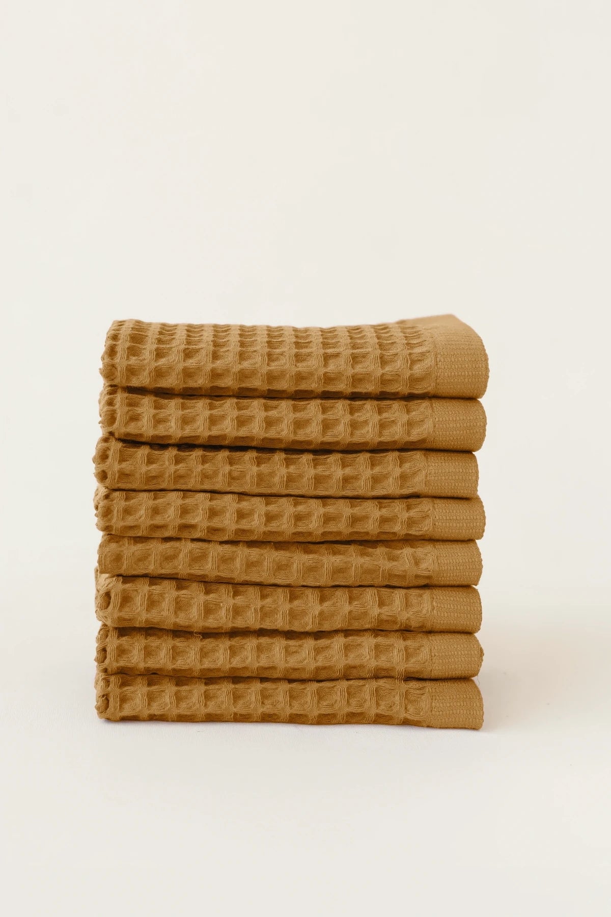 Caramel handwoven Turkish cotton waffle weave towel set of 8 washcloths stacked. Denizli, OEKO-TEX. Vivamaison.