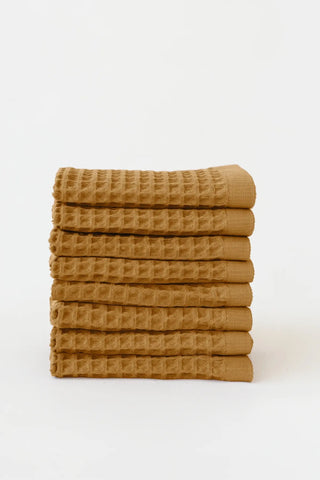 Caramel handwoven Turkish cotton waffle weave towel set of 8 washcloths stacked. Denizli, OEKO-TEX. Vivamaison.