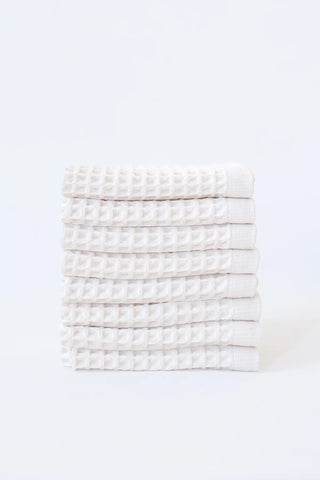 White handwoven Turkish cotton waffle weave towel set of 8 washcloths stacked. Denizli, OEKO-TEX. Vivamaison.