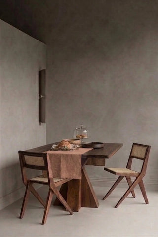 Brown plain linen cotton blend table runner styled in a modern dining room with cane chairs. 16 x 51 in, handmade in Denizli, OEKO-TEX. VivaMaison.