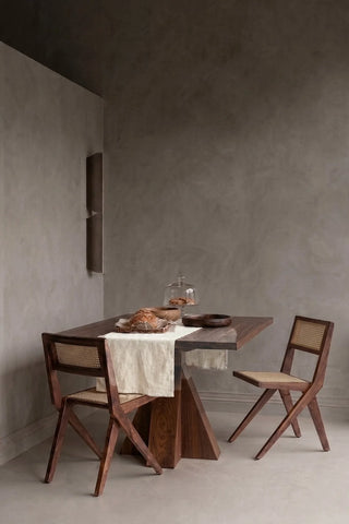 Natural plain linen cotton blend table runner styled in a modern dining room with cane chairs. 16 x 51 in, handmade in Denizli, OEKO-TEX. VivaMaison.