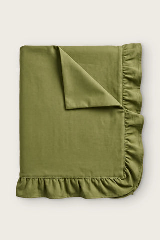 Ruffled linen cotton blend tablecloth in olive green, folded with corner turned back
