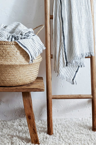 Muslin striped Turkish cotton beach towel peshtemal with black stripes on a wooden ladder and basket - VivaMaison