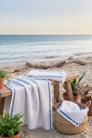 Muslin striped Turkish cotton beach towel peshtemal with blue stripes at a seaside picnic - VivaMaison