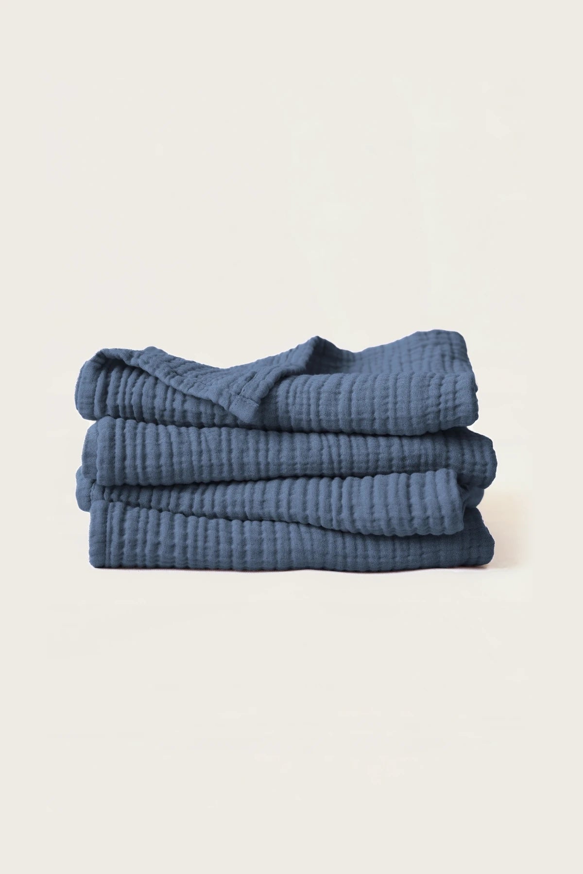 Stacked indigo blue muslin Turkish cotton towels with soft 4-layer gauze weave, handwoven in Denizli