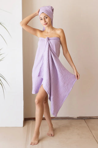 Lilac 4-layer muslin bath towel styled in a bathroom — handwoven Turkish cotton, OEKO-TEX certified Denizli