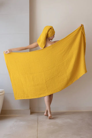 Close-up of mustard muslin gauze weave on a handwoven Turkish cotton towel from VivaMaison Denizli