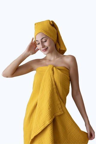 Mustard muslin Turkish towel in a warm home scene, handwoven OEKO-TEX certified VivaMaison cotton