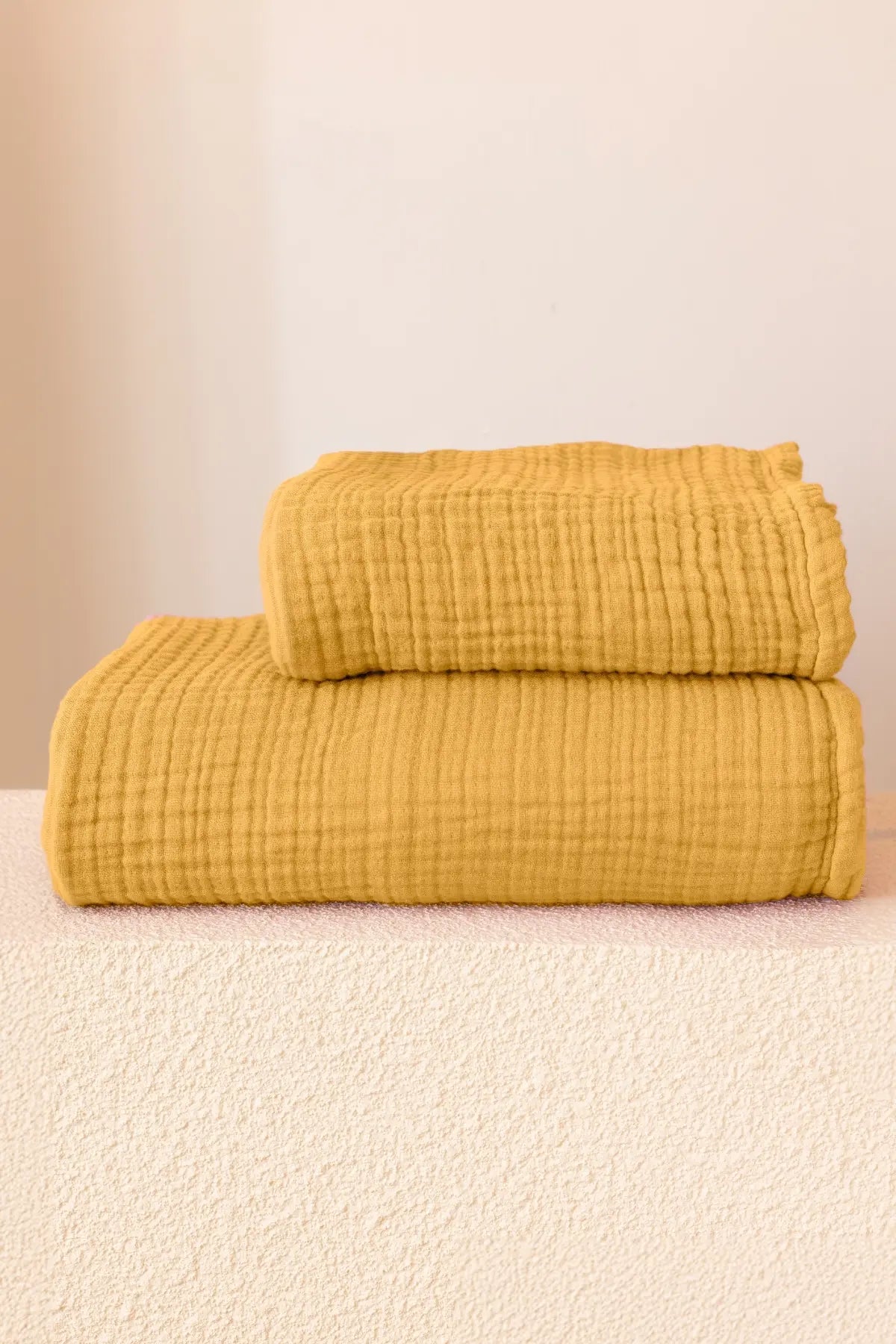 Mustard handwoven muslin towel in a styled bathroom setting, OEKO-TEX certified VivaMaison Turkish cotton