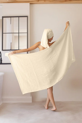 Natural muslin Turkish towel draped in a calm home setting, handwoven OEKO-TEX certified VivaMaison cotton