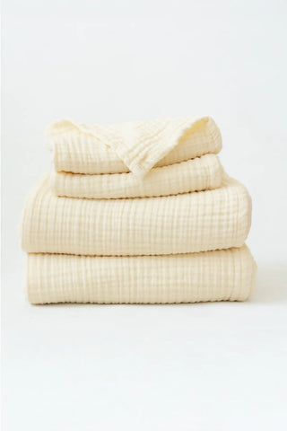 Stacked natural muslin Turkish cotton towels showing soft 4-layer gauze weave by VivaMaison Denizli
