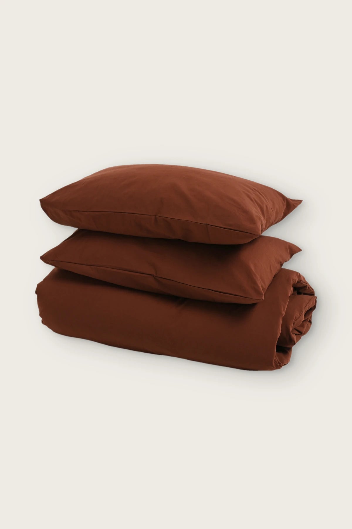 Stonewashed Turkish cotton duvet cover set in brown, folded duvet with two pillowcases, front view