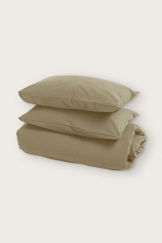 Stonewashed Turkish cotton duvet cover set in stone, folded duvet with two pillowcases, front view