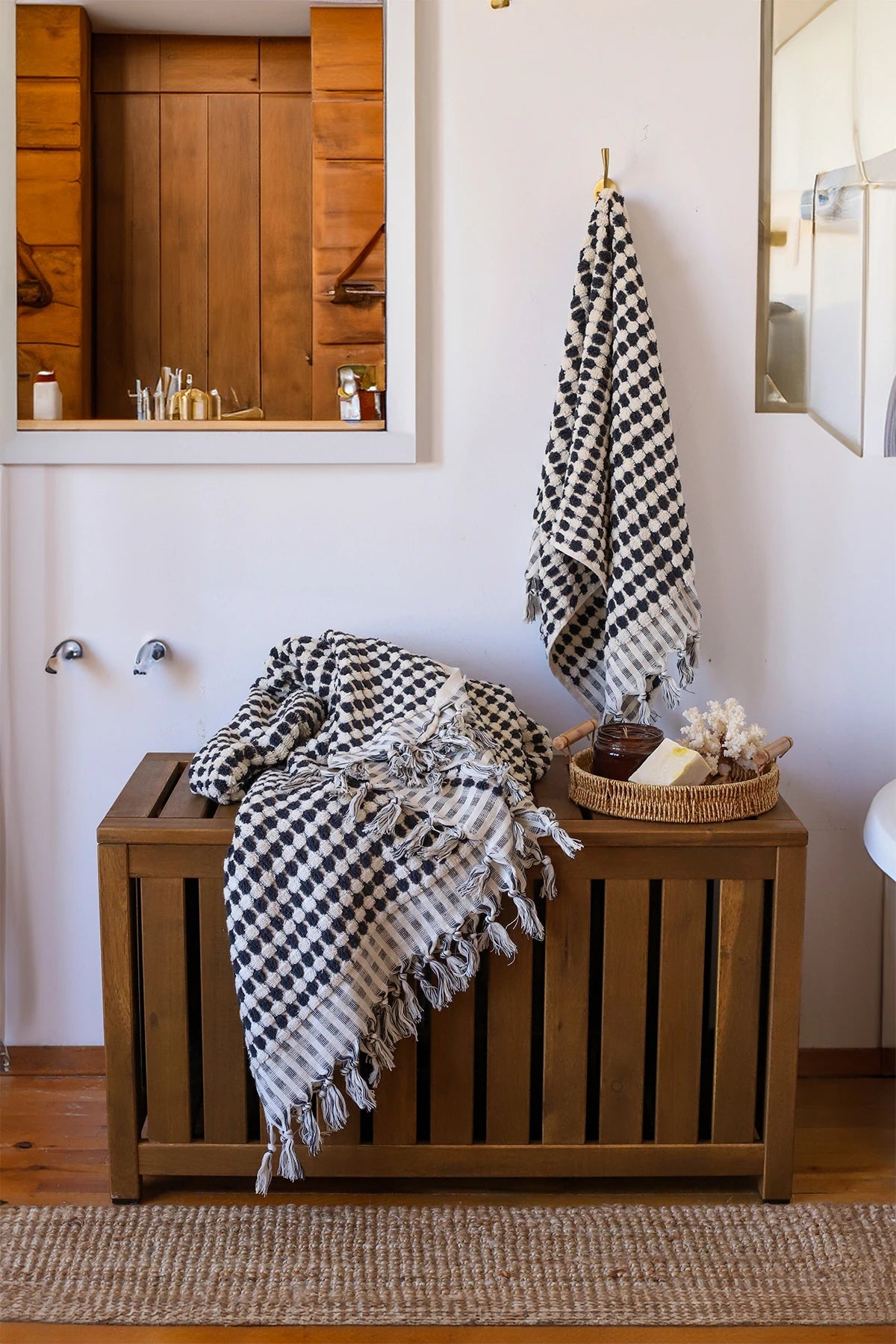 Anthracite White Turkish cotton mosaic towel in a bathroom, hanging and draped over a wooden chest - VivaMaison