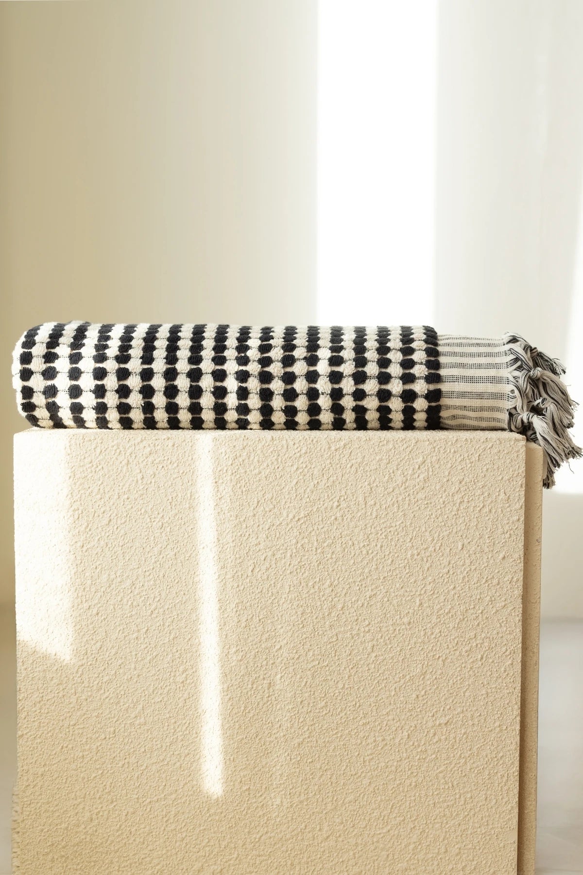 Anthracite White Turkish cotton mosaic towel folded on a plinth - VivaMaison