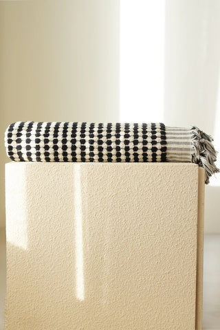 Anthracite White Turkish cotton mosaic towel folded on a plinth - VivaMaison