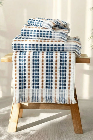 Blue Brown Turkish cotton mosaic towel stacked with one towel draped over the edge - VivaMaison
