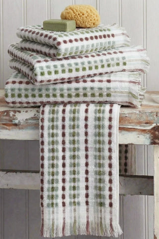 Sage Brown Turkish cotton mosaic towel stacked with one towel draped over the edge - VivaMaison