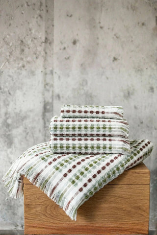 Sage Brown Turkish cotton mosaic towel stacked on a wooden block - VivaMaison